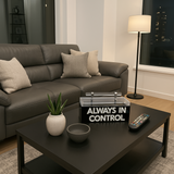 Black acrylic remote control storage box with bold white, clear mirror letters “ALWAYS IN CONTROL,” modern home accessory for coffee tables and living room organization