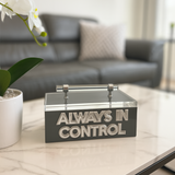 Gray acrylic remote control box with clear lid and silver handle, featuring “ALWAYS IN CONTROL” lettering, stylish storage solution for modern living rooms