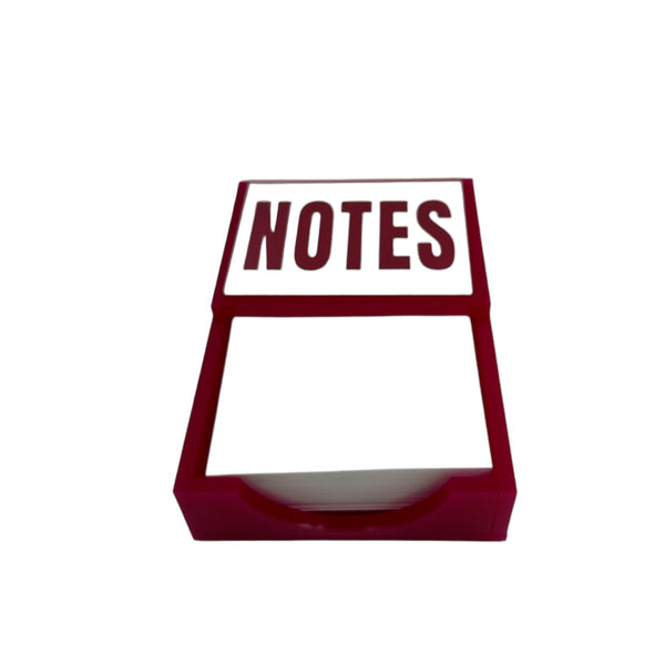 a notepad with the word NOTES imprinted on the the acrylic holder.  