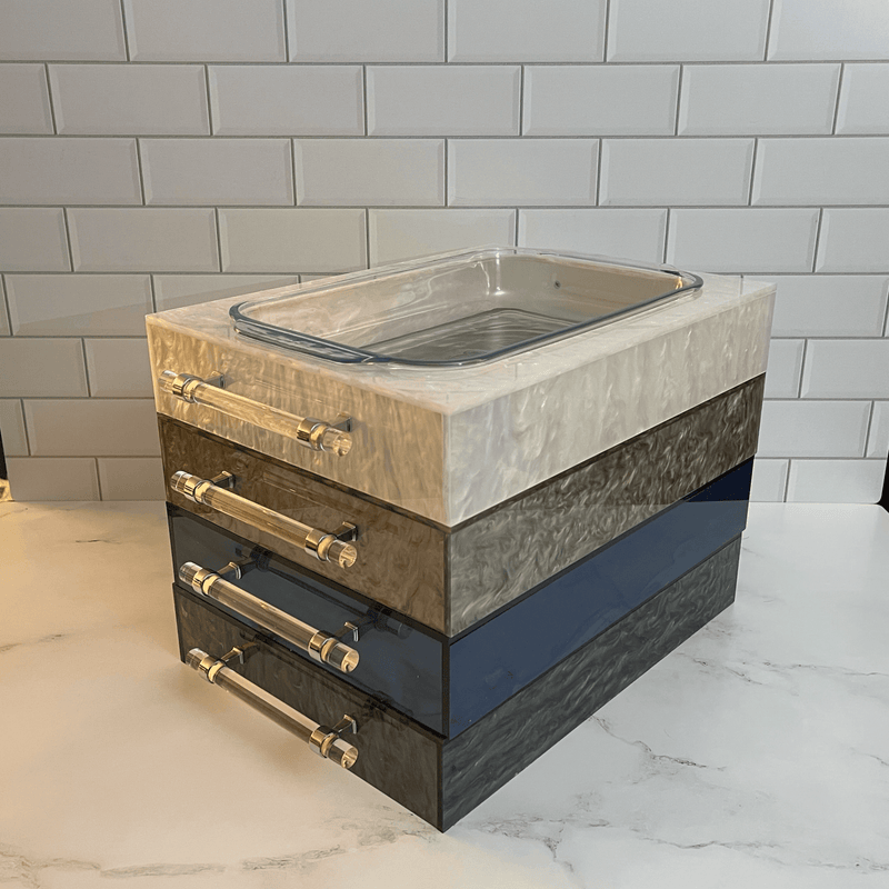 ACRYLIC PYREX MARBLE COLLECTION, in white, silver, dark blue and black marble on a kitchen counter