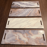 12x36 cheeseboard in grey gold, white gold, grey marble slice and grey bronze. on wood background