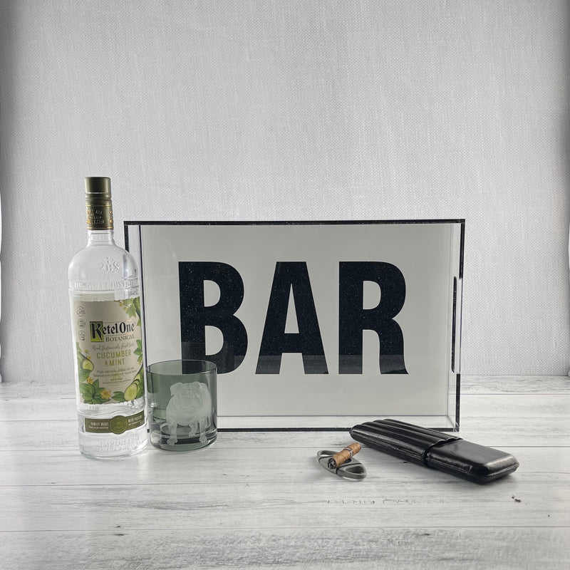 BAR tray on a bar featured with drink glass and a cocktail bottle. 