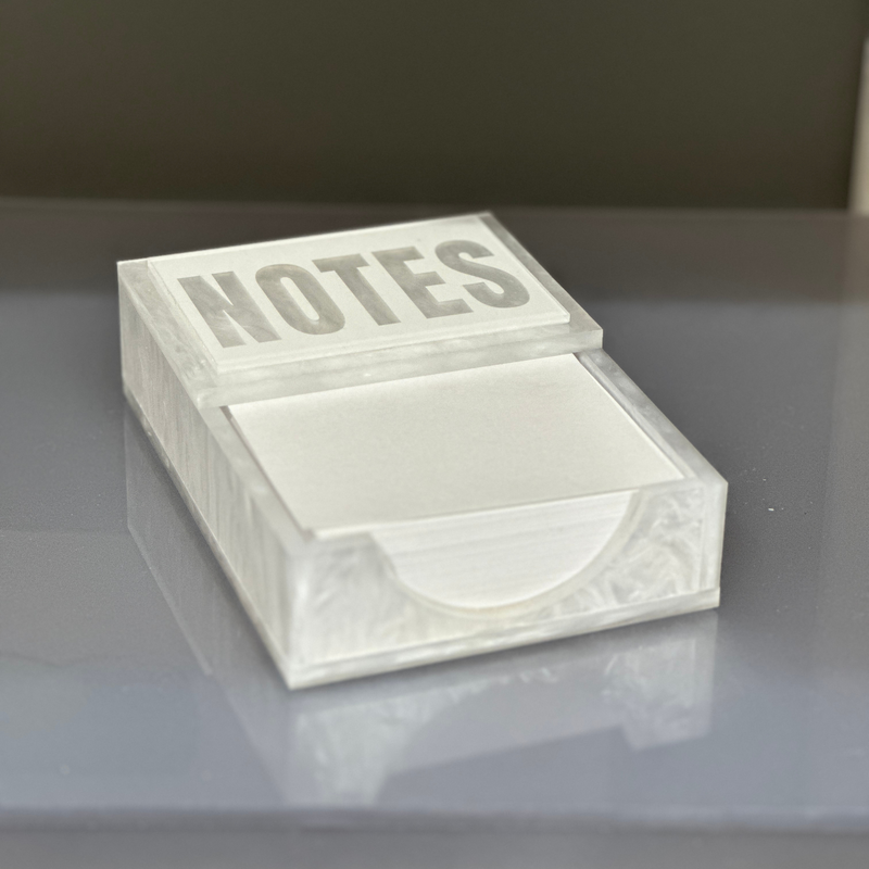 Notes desk accessory shown in white marble on a desk to use for your daily to do list.