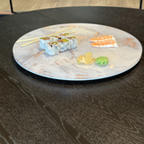 rotating lazy susan on a dining table displayed with sushi for easy entertaining.