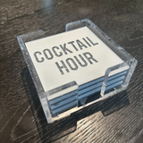 acrylic coaster set in white with the words COCKTAIL HOUR written in silver sparkle.