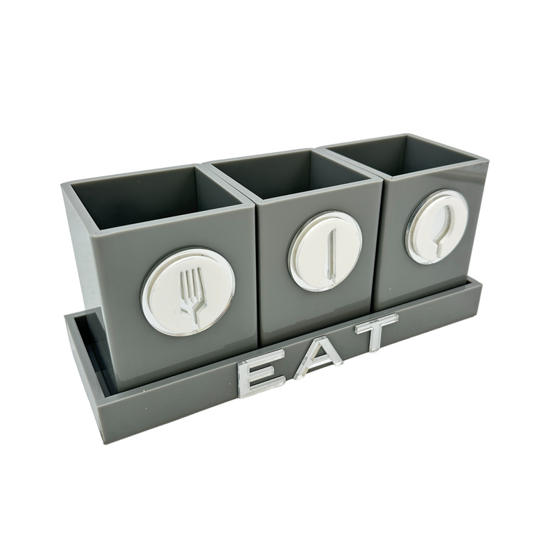 solid grey utensil caddy with 3 cups displaying a forks, knives and spoons decal in silver mirror.