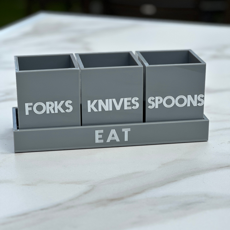 grey utensil caddy featured on a table for easy serving