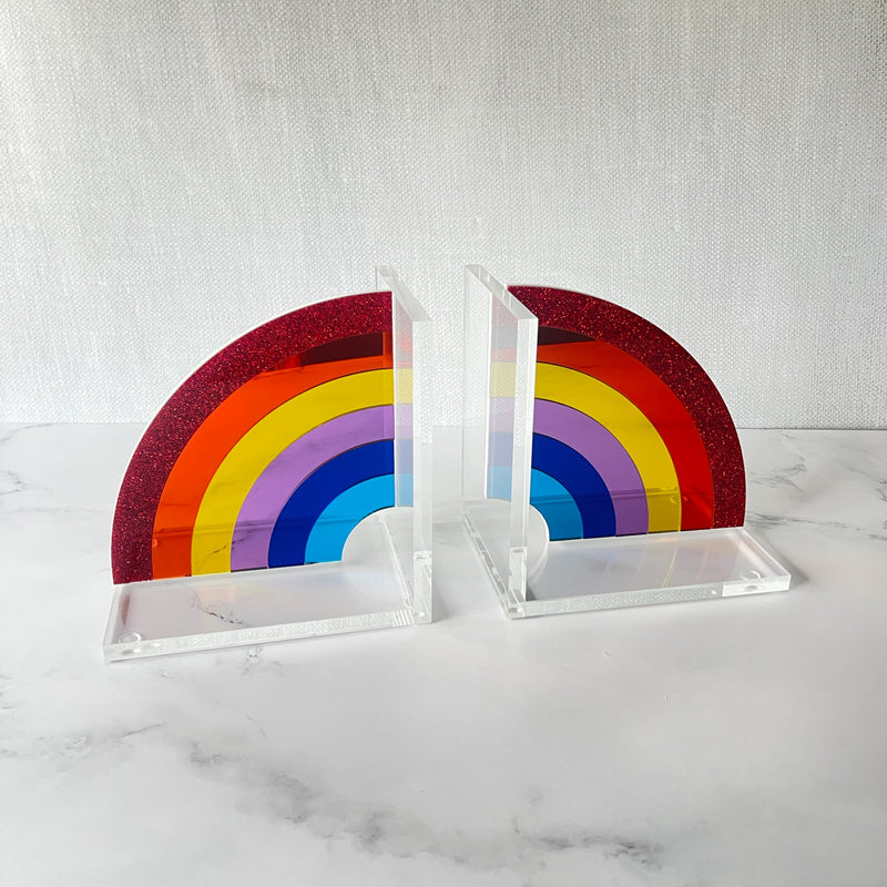 RAINBOW BOOKENDS showing stunning primary acrylic colors on a marble dresser.