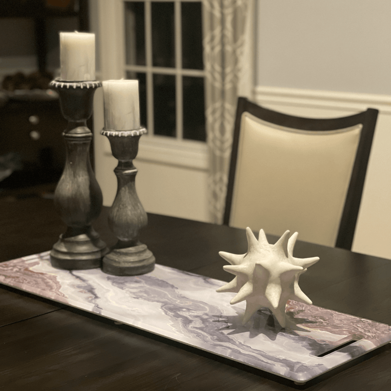 long charcuterie cheeseboard in grey bronze as a centerpiece on dining room table