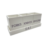 white solid utensil caddy on tray that says EAT with 3 cups saying FORKS, KNIVES and SPOONS , grey etched lettering