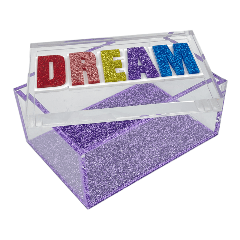 DREAM clear acrylic box with purple sparkle bottom  and lid laying diagonal on top of box showing you can put items inside it