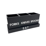 black matte utensil caddy on tray that says EAT with 3 cups saying FORKS, KNIVES and SPOONS , white etched lettering 