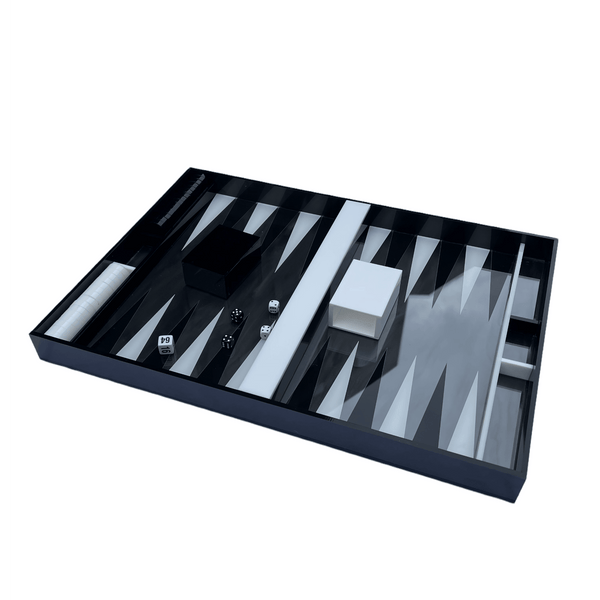 Backgammon set in black marble and white and black detail, chips, cups and dice