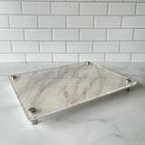 raised serving platter on a marble counter for Friday supper.