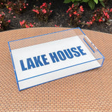 LAKE HOUSE tray on table next to flowers