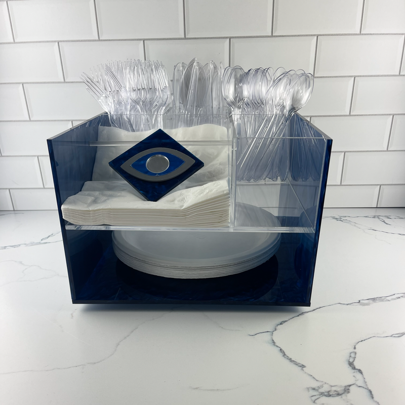 deluxe caddy with an evil eye on napkin stopper featured on a kitchen counter.